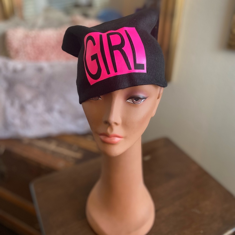 Signature black stocking cap for women. With the wording GIRL in hot pink